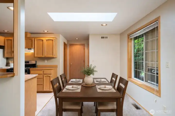 The dining area off the kitchen, shown here virtually staged.