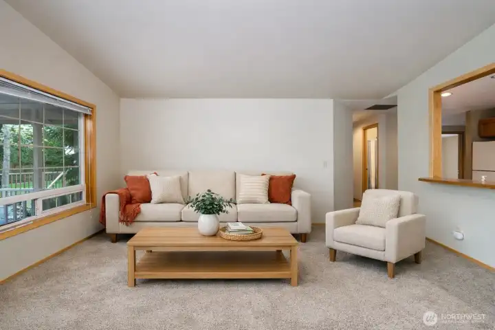 Enjoy the living room’s picture window looking out over the backyard. Virtually staged.