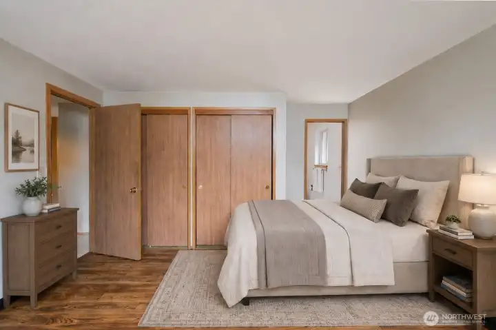 Primary bedroom featuring an ensuite 3/4 bath, virtually staged.