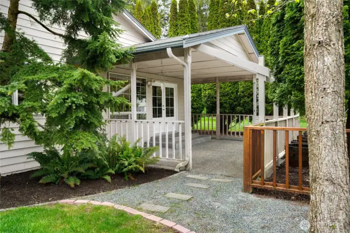 Covered back patio perfect for gatherings in any weather.