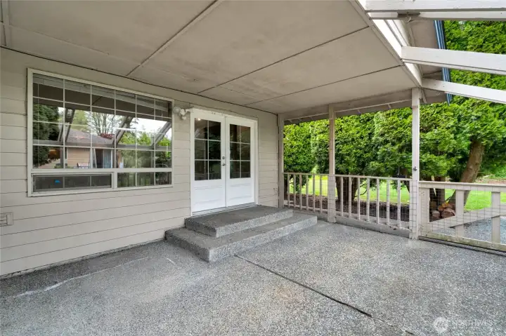 Back patio with exposed aggregate.