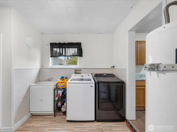 1/2 bath on the left, gas water heater on the right. Gas dryer 1/2 bath on the left, gas water heater on the right. Gas dryer