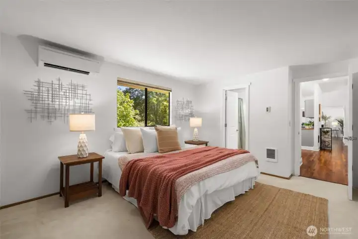 Primary suite situated on one side of the home for added privacy.