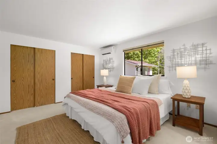 Spacious primary suite with dual closets