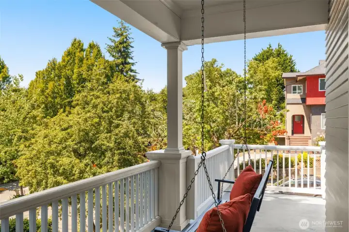 Rainy outside? You can still enjoy the outdoors from your covered porch swing!