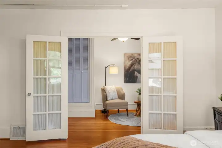 The primary bedroom has an adjoining sitting room