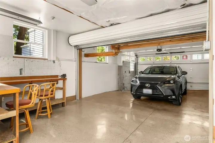 Two-car garage parking, with roll-up door to allow longer vehicles extra space or for ease of loading/unloading