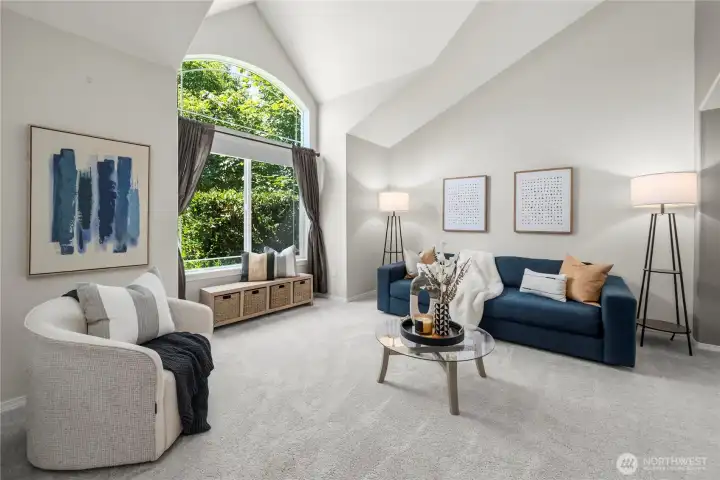 The cozy living room offers a warm and inviting space to relax or gather with guests.