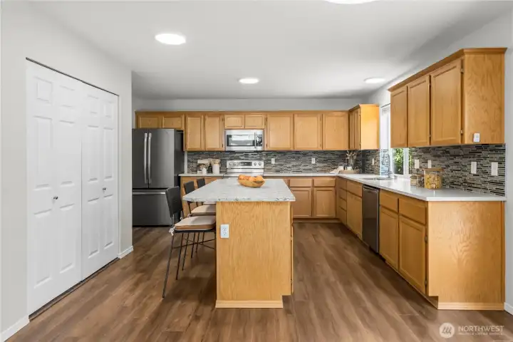 Beautifully designed space featuring a stylish designer backsplash that adds a touch of elegance and character