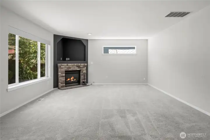 The large family room is the perfect place for movie nights, game days, or simply unwinding at home.