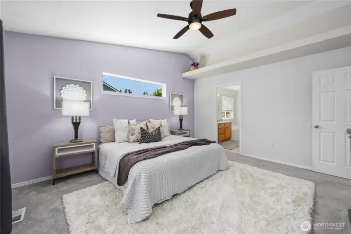 Architectural vaulted ceilings and an upper storage ledge combine style with everyday functionality.