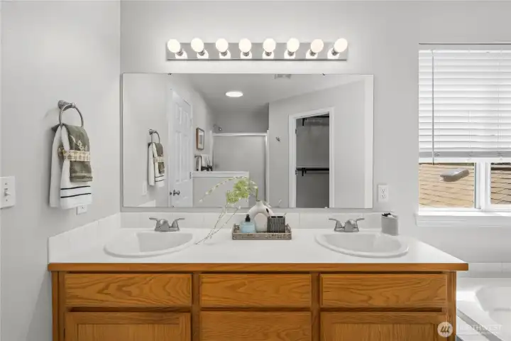 Spacious double-sink vanity offers convenience and plenty of room for busy mornings.