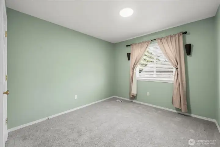 Inviting upstairs bedroom with a bright, airy feel and ample closet space.