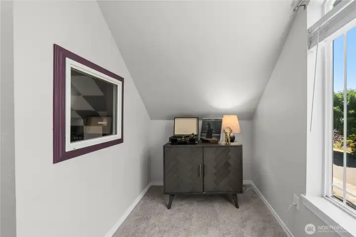 A delightful little nook with a sunny window, perfect for a quiet retreat or decorative touch.