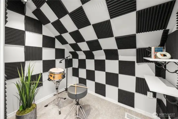 Versatile bonus room with a built-in sound and recording studio—ideal for musicians, creators, or a private workspace.