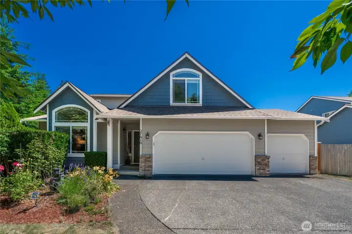 Major updates include a newer roof, gutters, water heater, interior paint, and carpet for added peace of mind.