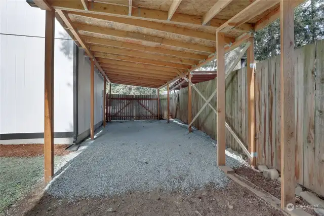 This Carport behind the double-gated and fenced yard will easily cover 2 vehicles. Could also convert into shed, dog run, another Covered Patio, etc, if you don't need it as a carport. Plenty of parking here!