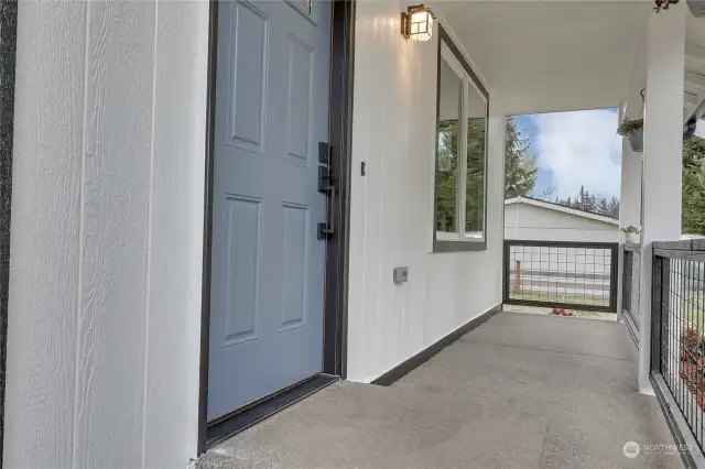 Enter via Covered Front Porch w/New Front Door. Notice the updated railings. Perfect spot to enjoy your morning cup of joe!