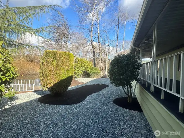 Extremely low maintenance yard. Behind the dock on the left you can see the waterfront.