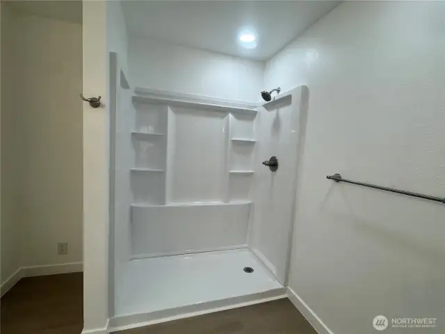 The shower in the primary bathroom.