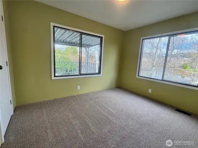 Bedroom 3 looks right out at the waterfront.
