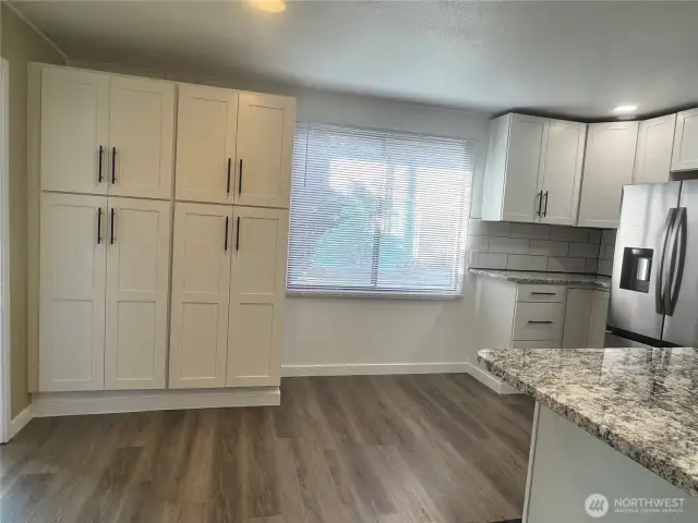 Beautiful new quartz countertop and large cabinets highlight this kitchen.