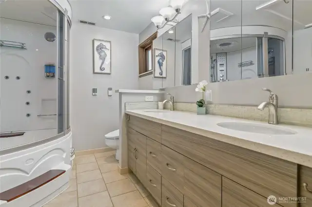 Spacious Spa-Like Primary Bath with Double Sinks, Tons of Storage,, Heated Floors and Towel Rack.