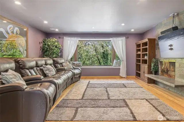 Large Living Room overlooking the Pool & Woods with Wood Burning Fireplace
