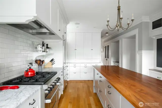 Beautiful wood and marble countertops, ample cabinet storage and a great working footprint.