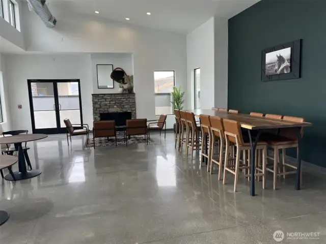 Inside the clubhouse, lots of compy sitting areas, inside bathroom, fireplace  and meeting room.