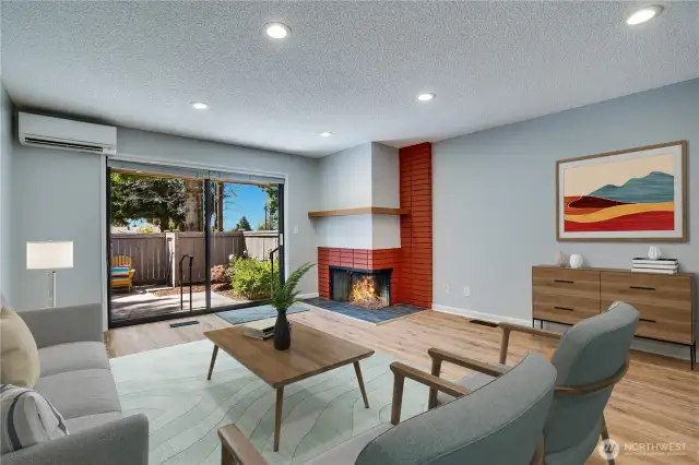 Spacious living room/dining area that has sliding door to patio area. This photo is Virtually Staged.