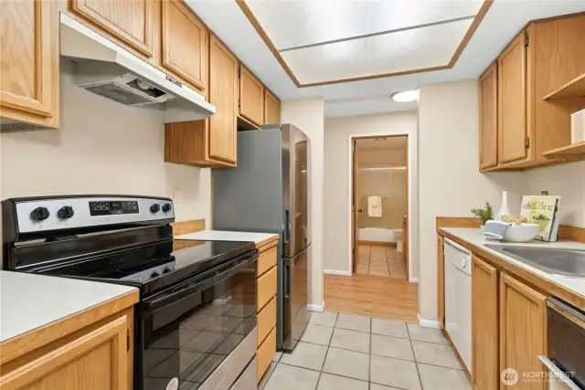 Galley kitchen from front door to dining room.