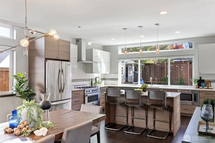 This immense kitchen offers ample Euro-style cabinetry with tons of storage and prep space!