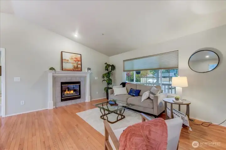 Hardwood floors and gas fireplace in living room
