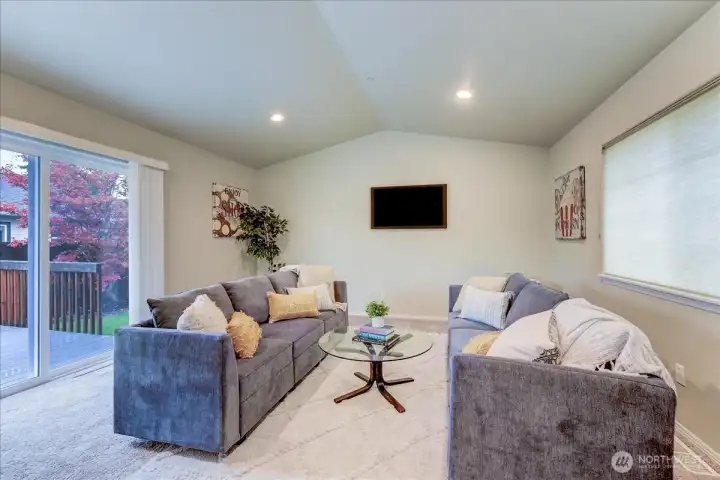 This additional space could be a 4th bedroom, and has a slider to the deck