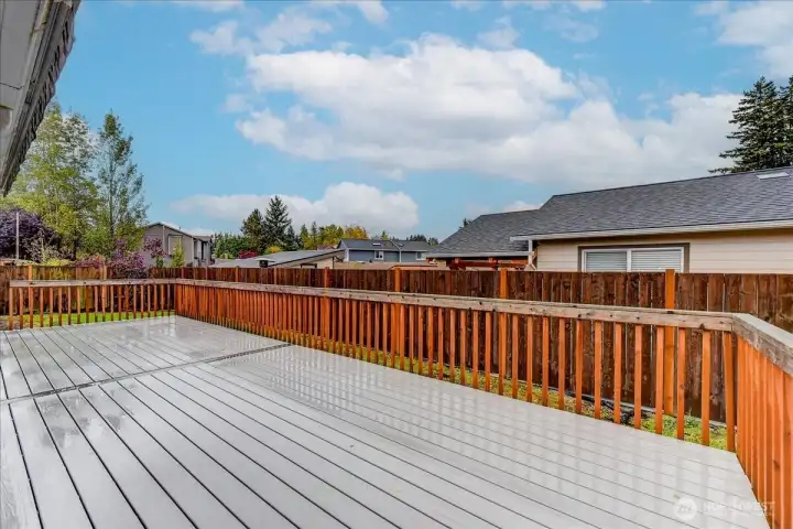 Composite deck is about 3/4 length of the back of the house and has a section with an awning, for shade in the summer.