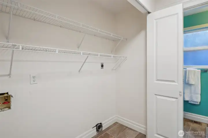 Utility room off of garage, view of 1/2 bath on MAIN floor