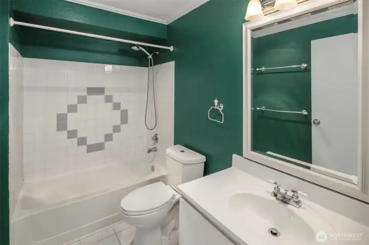 The full bathroom is accessed in the hallway near the kitchen, that way your guests aren't needing to pass through the primary. A proper tub is always nice!