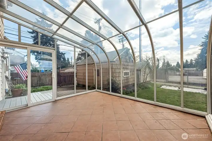 A permitted 12×14 solarium adds a bright and relaxing space to enjoy year-round.