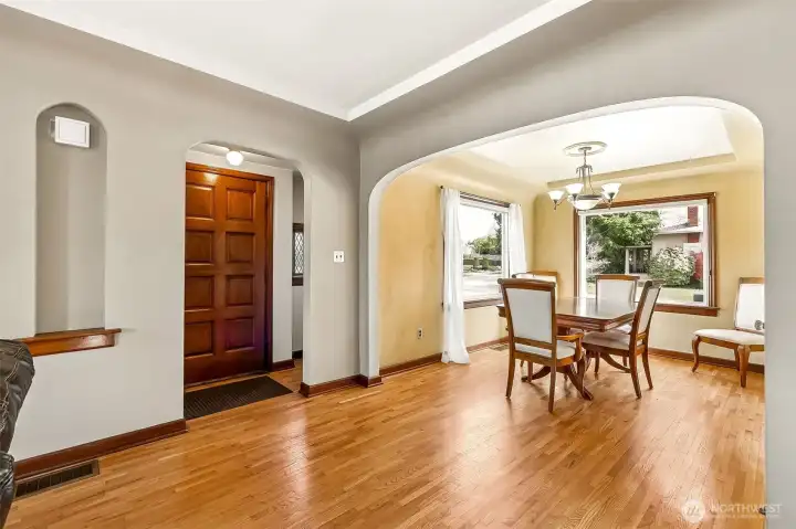 Craftsman-era charm shines throughout with a welcoming entry vestibule with leaded glass sidelights.