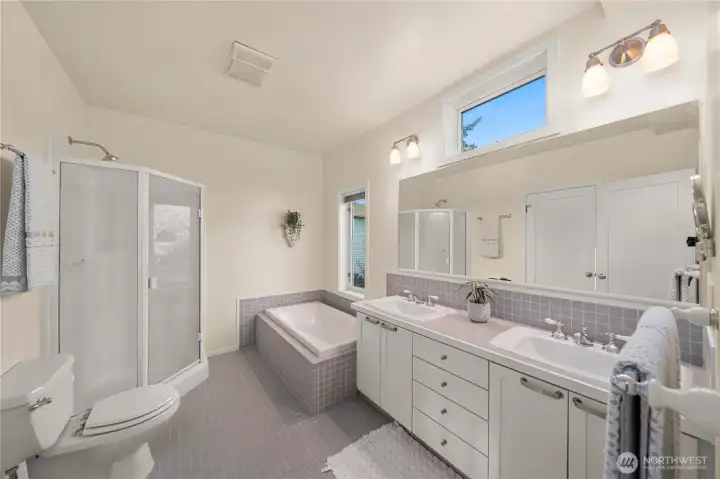 Primary bathroom with large walk in closet attached