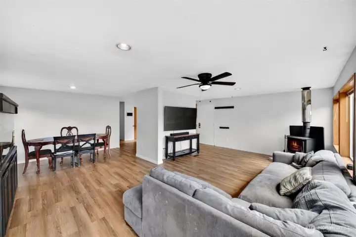 The home flows from the front room to dining room and kitchen.