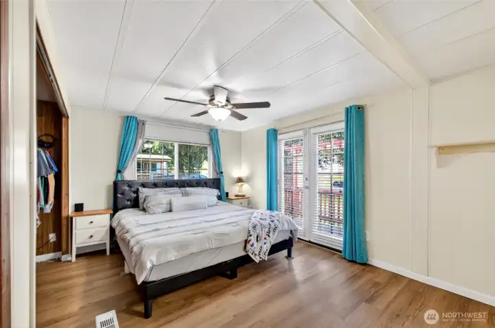The primary suite includes it's own bathroom plus french doors leading to a private deck.
