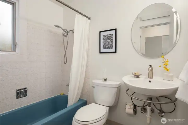 Bathroom between hallway and bedroom.