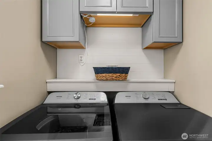 Laundry area with storage