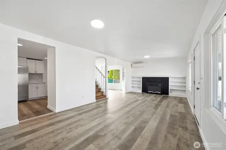 Huge bright living room with Electric fire place and mini split