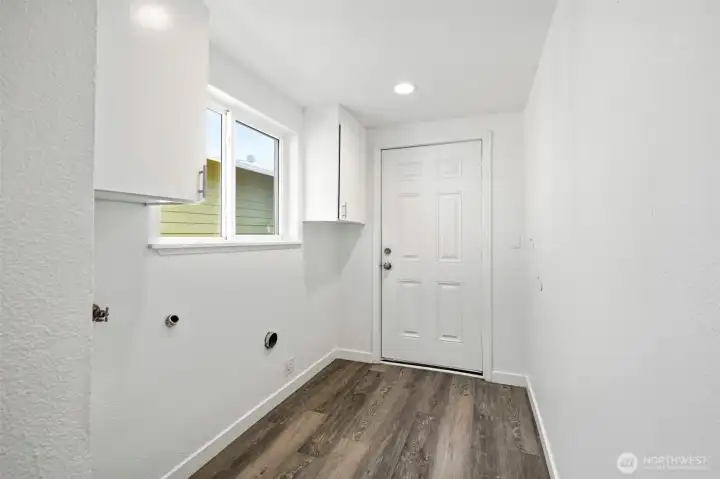 Laundry area, door lead to gara and back yard