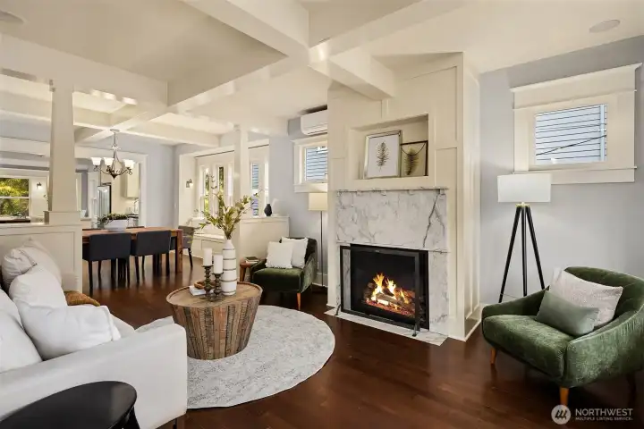 A living space that feels both grounded and elevated—coffered ceilings overhead, marble fireplace anchoring the room, and proportions that make it just as suited for quiet evenings as it is for a full house. A living space that feels both grounded and elevated—coffered ceilings overhead, marble fireplace anchoring the room, and proportions that make it just as suited for quiet evenings as it is for a full house.