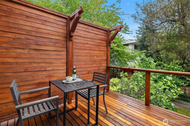 A tucked-away outdoor escape—perfect for slow mornings with coffee or an evening glass of wine—offering just enough privacy to feel removed, yet seamlessly connected to the rhythm of the home. A tucked-away outdoor escape—perfect for slow mornings with coffee or an evening glass of wine—offering just enough privacy to feel removed, yet seamlessly connected to the rhythm of the home.