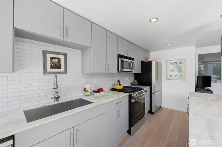 Check out the stainless-steel sink with white subway tile backsplash. Check out the stainless-steel sink with white subway tile backsplash.